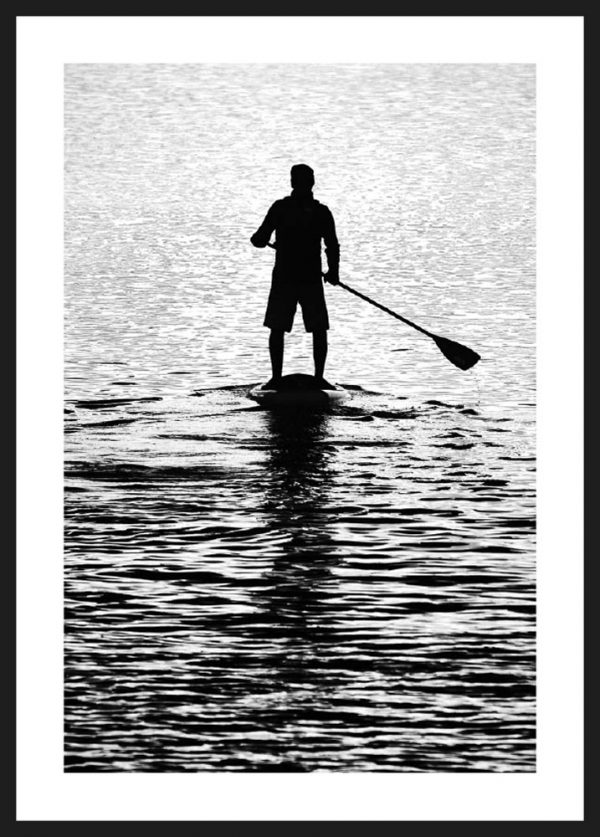 man on a paddleboard ramme bw